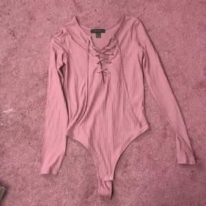 Pink lace up bodysuit.